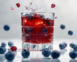 blueberry juice splash in a glass photo