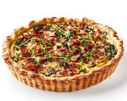 a quiche with bacon and spinach on top photo