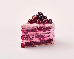 a piece of cake with berries on top photo