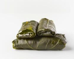 three wrapped leaves sit on top of each other photo