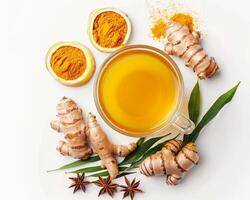 turmeric and ginger tea with spices on white background photo