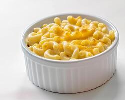 a white bowl filled with macaroni and cheese photo