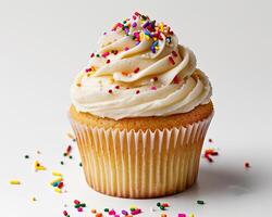 a cupcake with sprinkles on top photo