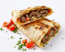 a beef and tomato wrap with a slice cut in half photo
