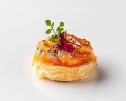 a small pastry on a white surface photo