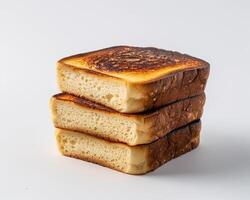 three slices of toasted bread on a white background photo