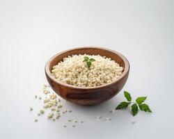 a bowl of rice with a sprig of mint photo