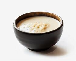 a bowl of soup with a spoon in it photo