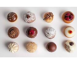 a variety of different types of donuts are shown photo