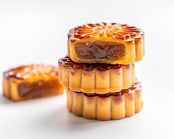 a stack of three moon cakes sitting on top of each other photo