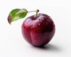 a red apple with a leaf on it photo