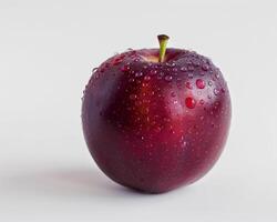 a red apple with water droplets on it photo