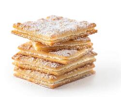 a stack of sugar cookies with powdered sugar on top photo