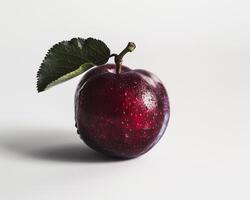 a single red apple with a leaf on it photo