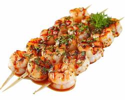 Shrimp skewers with sauce and herbs on a white background photo