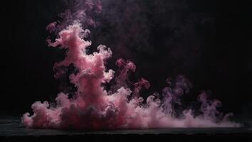 A pink smoke cloud on a black background photo