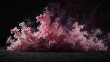 A pink smoke cloud on a black background photo