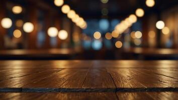 Empty wooden table top with lights bokeh on blur restaurant background. photo