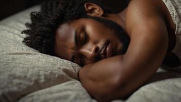 African American young man sleeping tightly in bed, top view with copy space, concept of sweet dreams, take a good rest, sleeping issue and insomnia. photo