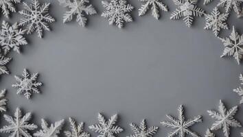 Christmas composition Frame made of snowflakes on pastel gray background Christmas, winter, new year concept Flat lay, top view, copy space. photo