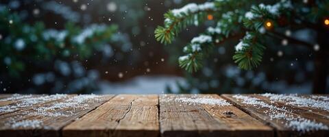 Christmas snowy holiday background with evergreen branches of spruce and empty wooden table top. photo