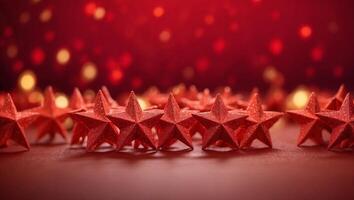 Red stars shapes at the top on red background Christmas winter holiday concept flat lay top view with copy space. photo