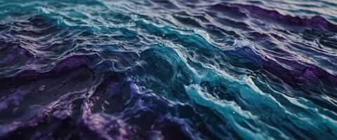 Abstract rough textures in blue and purple evoke the wild beauty of ocean waves, rendered in complementary colors for a dramatic art piece. photo