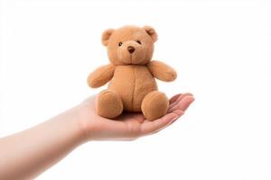 hand hold brown toy bear photo