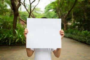 child hand hold blank paper photo