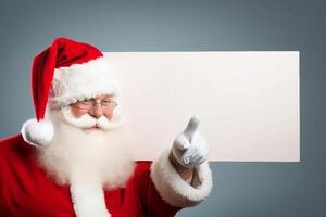 santa claus pointing to blank paper photo