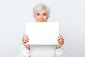 senior old woman hold blank paper on white photo