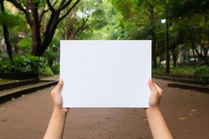 child hand hold blank paper photo