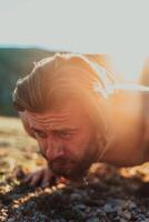 Athlete doing push-ups in the early morning. The concept of a healthy life photo
