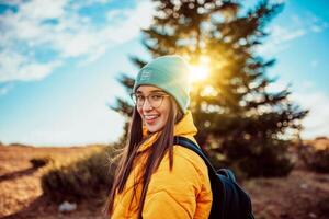 Portrait of a young happy hiker in the nature photo