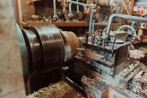 Close-up photo of a lathe working on wood. Mechanical processing of wood