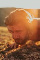 Athlete doing push-ups in the early morning. The concept of a healthy life photo