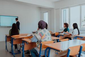 A diverse group of students is attentively listening, actively participating, and embracing modern education in a dynamic classroom setting, fostering collaboration and stimulating creativity. photo