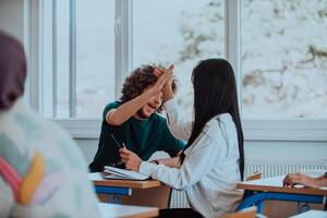 In a heartwarming scene, a diverse group of students enthusiastically high-five each other, celebrating the successful achievement of their shared goal, showcasing the power of teamwork and unity photo