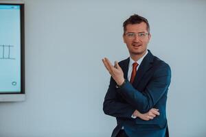 A modernly dressed professor engages in educating students, who listen attentively, creating a dynamic scene of knowledge-sharing and focused learning in the classroom. photo