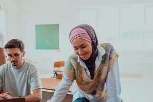 A businesswoman wearing a hijab leads a corporate meeting with a wide smile, showcasing her professionalism, confidence, and inclusive leadership in modern attire photo