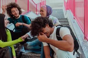 A diverse group of students sits on the steps of a modern school hallway during an educational break, sharing laughter, jokes, and knowledge, embodying a sense of unity and camaraderie. photo