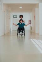 African-American hospital technician compassionately navigating the hospital hallways, pushing his wheelchair-bound colleague, symbolizing unity, support, and inclusivity photo