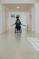 African-American hospital technician compassionately navigating the hospital hallways, pushing his wheelchair-bound colleague, symbolizing unity, support, and inclusivity photo