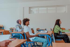 A diverse group of students is attentively listening, actively participating, and embracing modern education in a dynamic classroom setting, fostering collaboration and stimulating creativity. photo