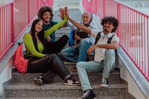 A diverse group of students symbolizes unity as they interlace their hands, portraying a sense of community, collaboration, and inclusive harmony photo