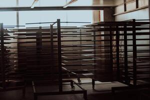 A vast warehouse in the forestry industry, showcasing a plethora of wooden products, including boards and various timber items neatly organized in storage photo