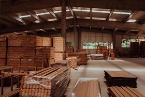 A vast warehouse in the forestry industry, showcasing a plethora of wooden products, including boards and various timber items neatly organized in storage photo