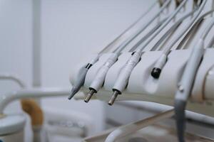 Close-up capture of meticulously arranged dental instruments, showcasing the precision and professionalism essential for thorough dental procedures and precise tooth treatments photo