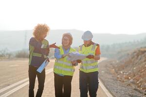 A team of engineers and workers oversees a wind turbine project at a modern wind farm, working together to ensure the efficient generation of renewable energy photo