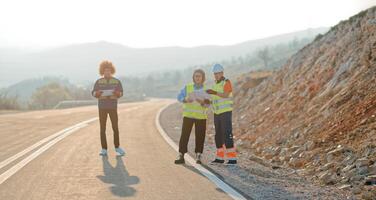 A team of engineers and workers oversees a wind turbine project at a modern wind farm, working together to ensure the efficient generation of renewable energy photo
